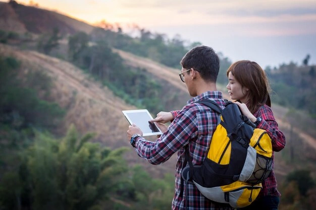 young couple using digital tablet by mountains 1048944 8772473
